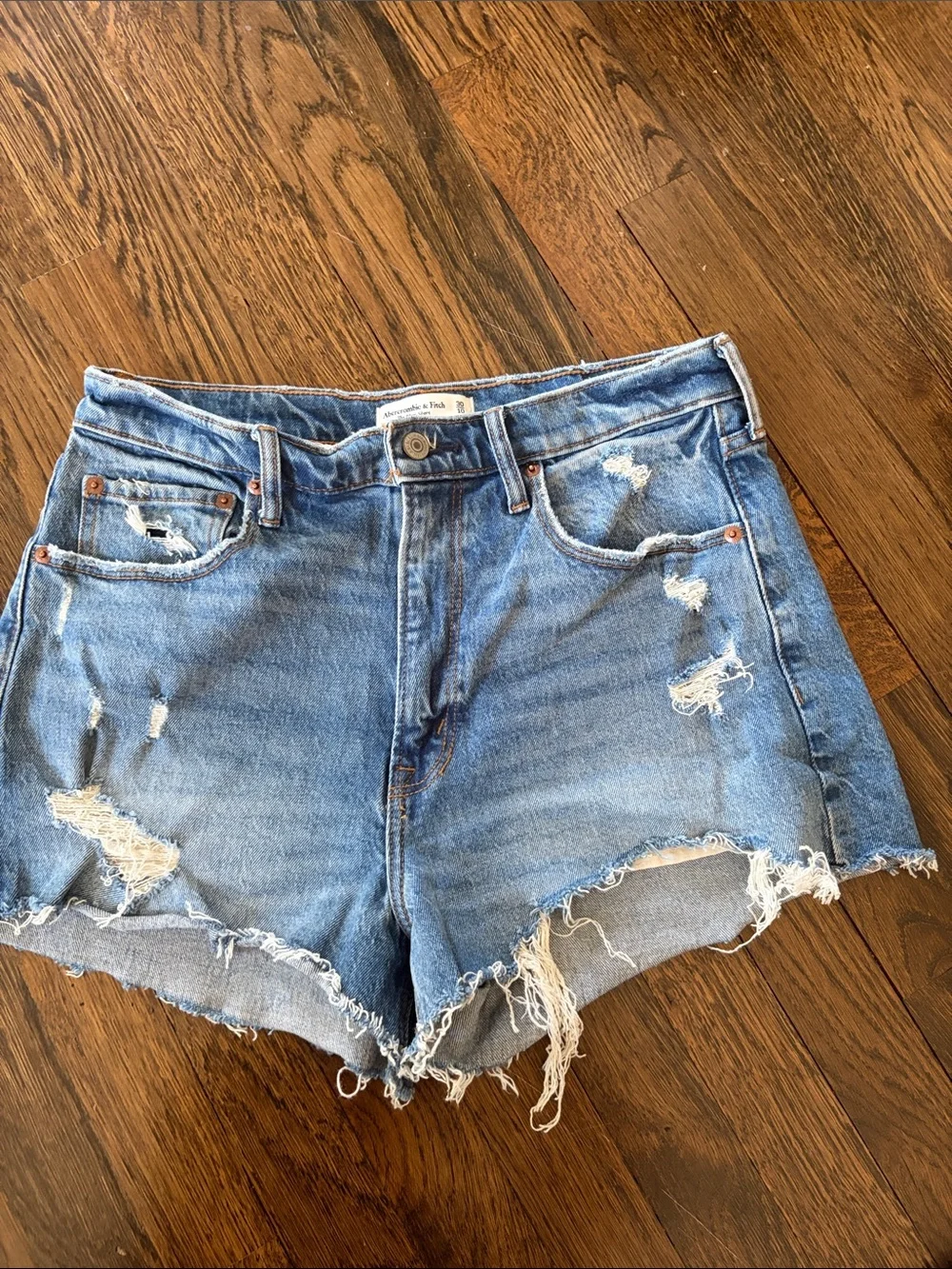 Distressed Light Blue Denim Shorts - Women's